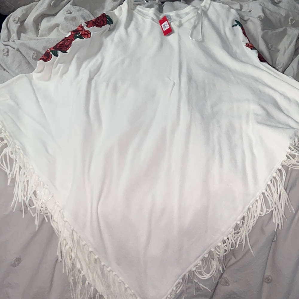 white poncho with roses